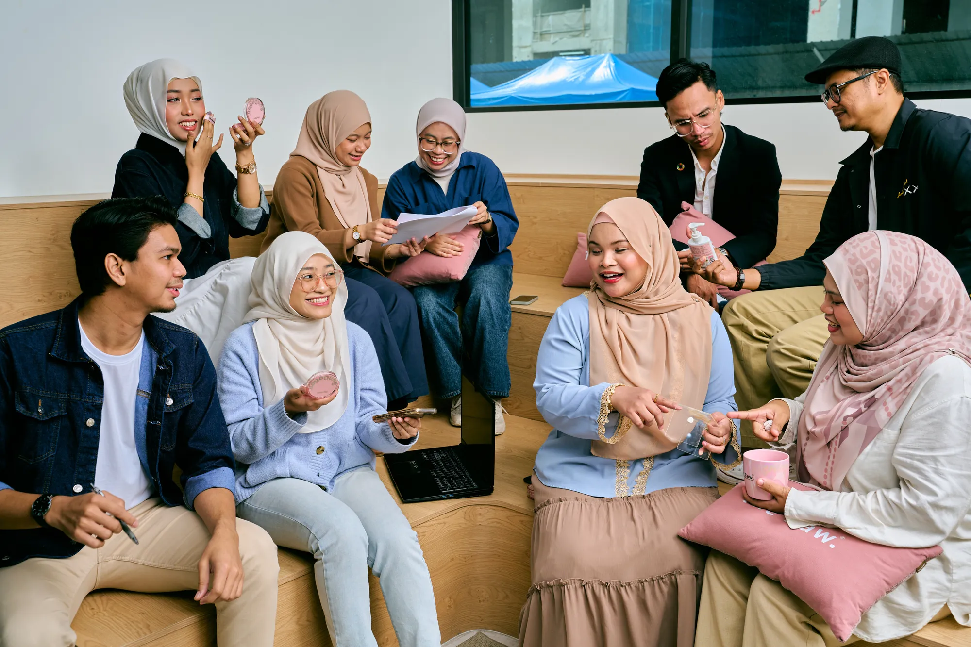 The Raw team talking together on the office lounge